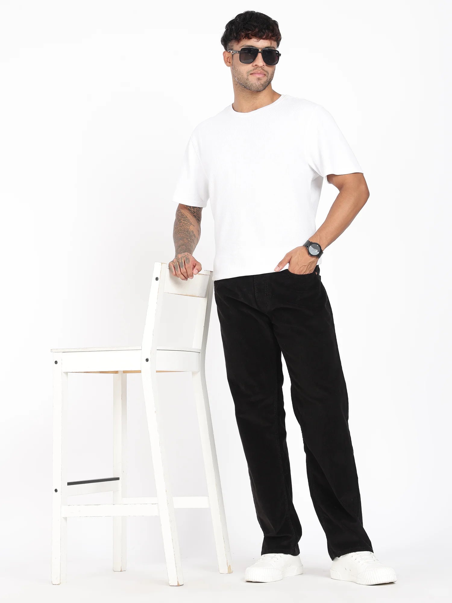 Jet Black corduroy pants for men – tan leather patch detail
