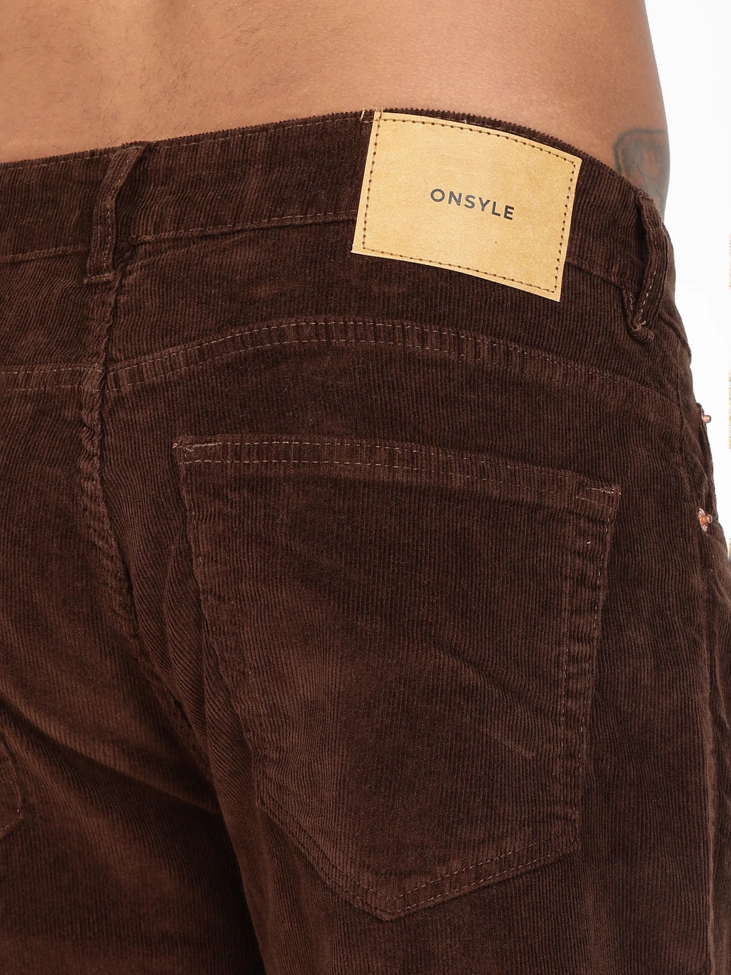 Chestnut corduroy pants for men – tan leather patch detail